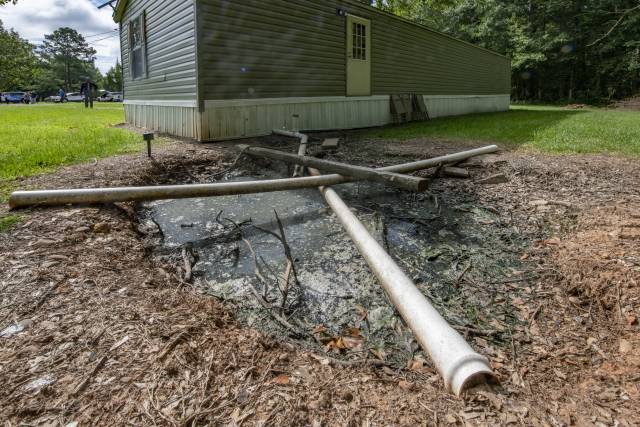 Backyard of a home in Alabama with sewage